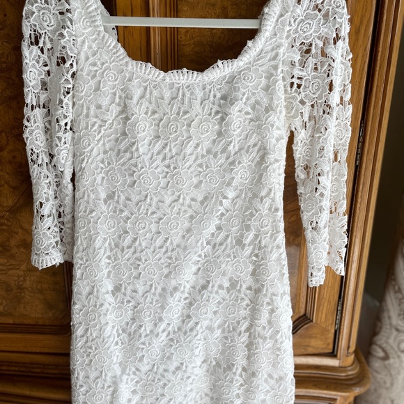 White House black-market Dresses & Skirts - White House Black market white lace dress. Size 2. Will fit a size 4.